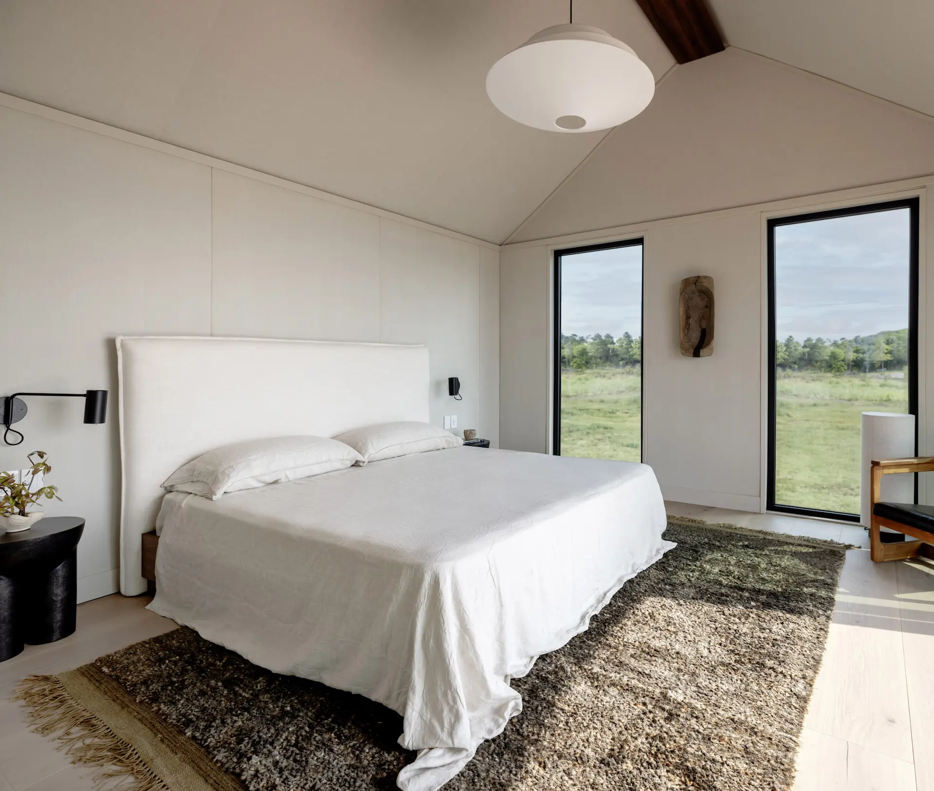Interior of a Villa room in Governors Island with king size bed.